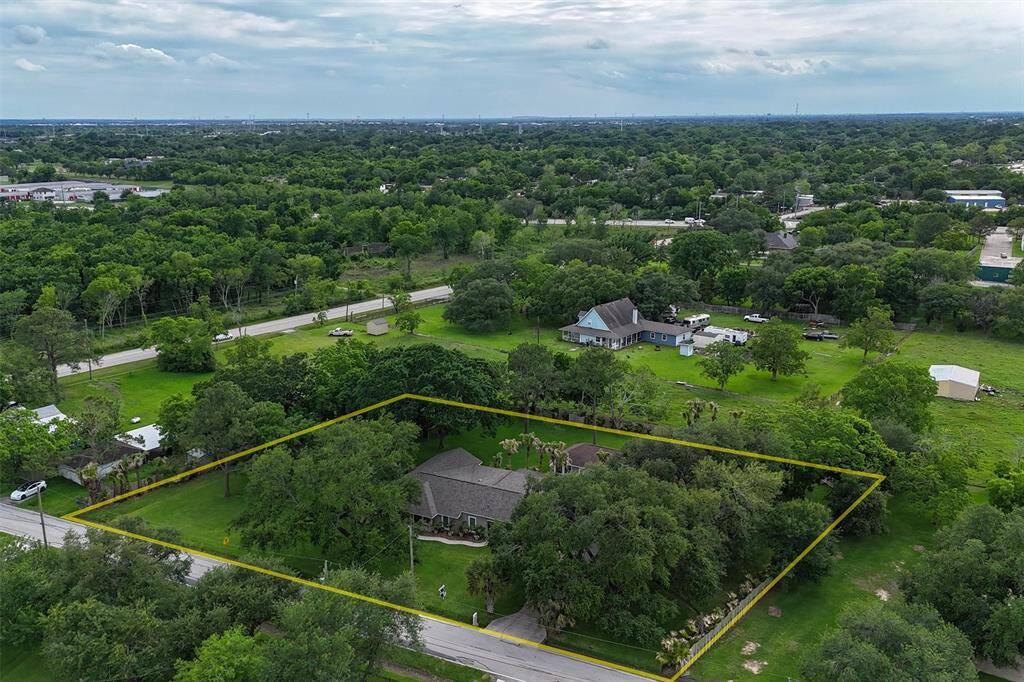 Welcome home to this pristine 4/4.1/2 car carport home on 1.11 acre in the heart of League City!