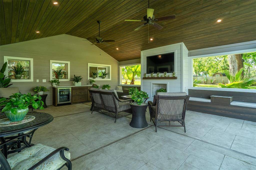 Brand new covered back patio off the main house. Gorgeous modern fireplace, tiled floors and recessed lighting