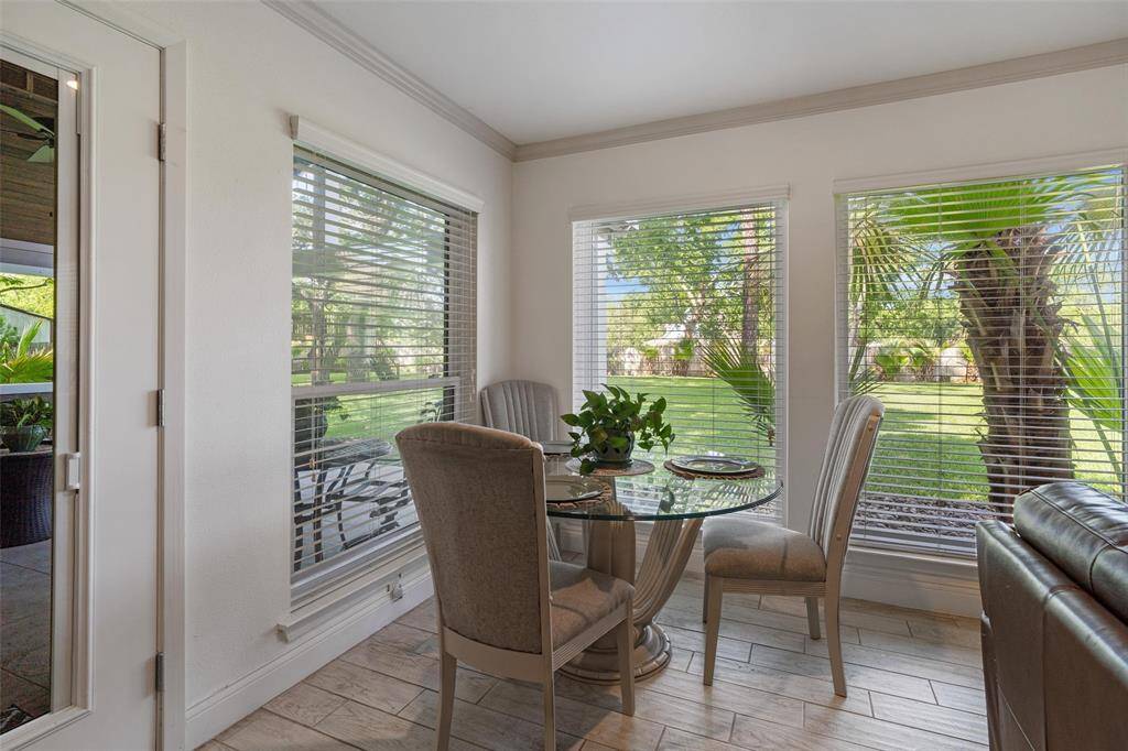 Breakfast space surrounded by windows overlooking your 1.11 acre property!