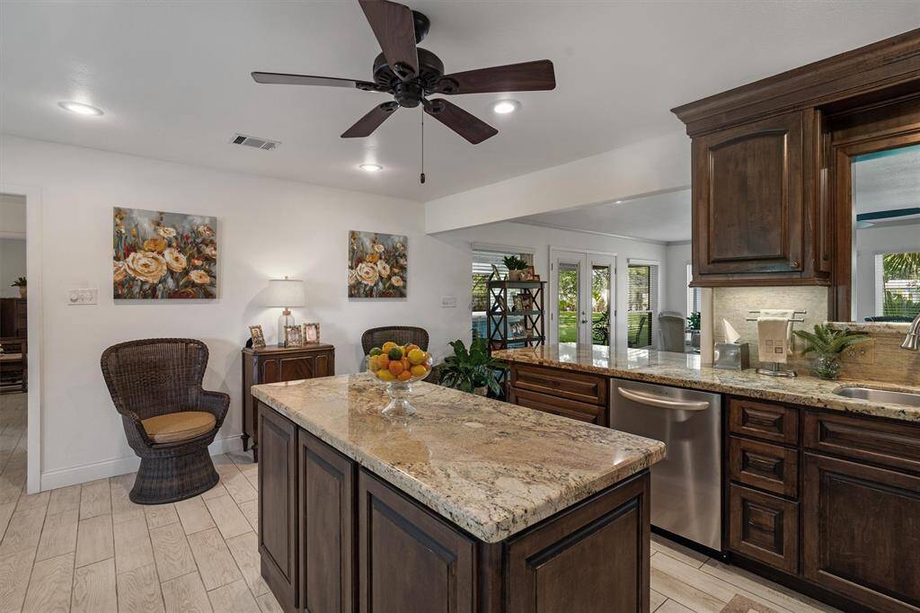 Granite countertops, center island and plenty of storage