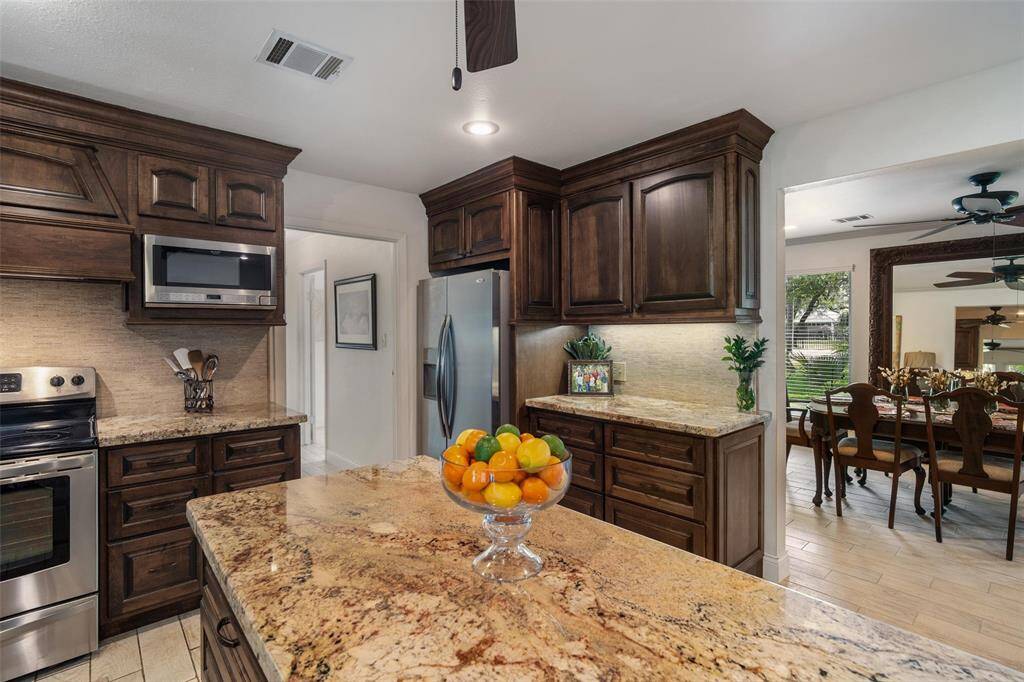 Tons of storage and counter space and stainless steel appliances in this gorgeous kitchen