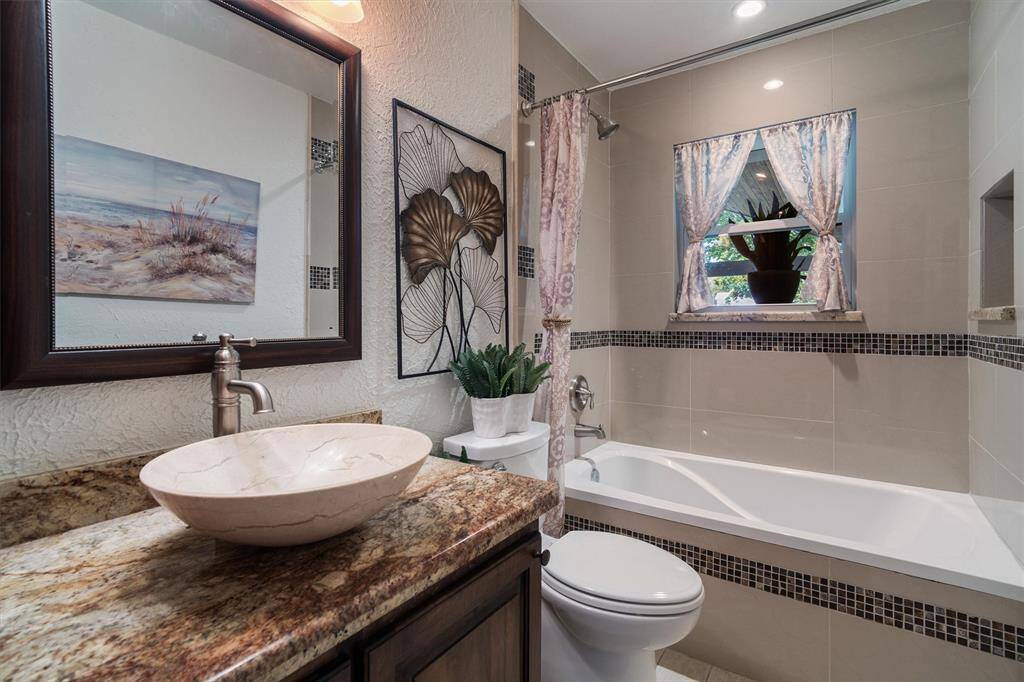 Third full bath with designer sink and fully tiled tub/shower combo