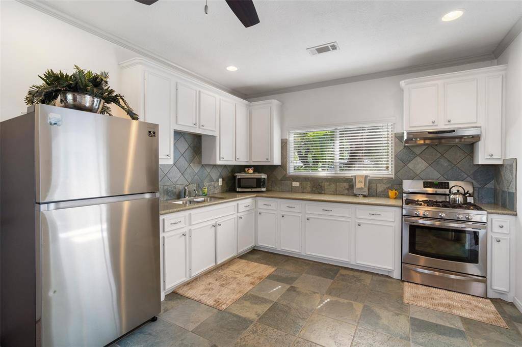 Full kitchen in the guest house, tons of storage space and stainless steel appliances.