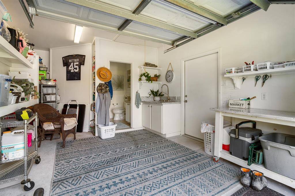 Garage with sink. Could be convered to a bedroom with attached full bath or leave it as a great man-cave! Opens to two covered areas used for grilling and smoking meats.