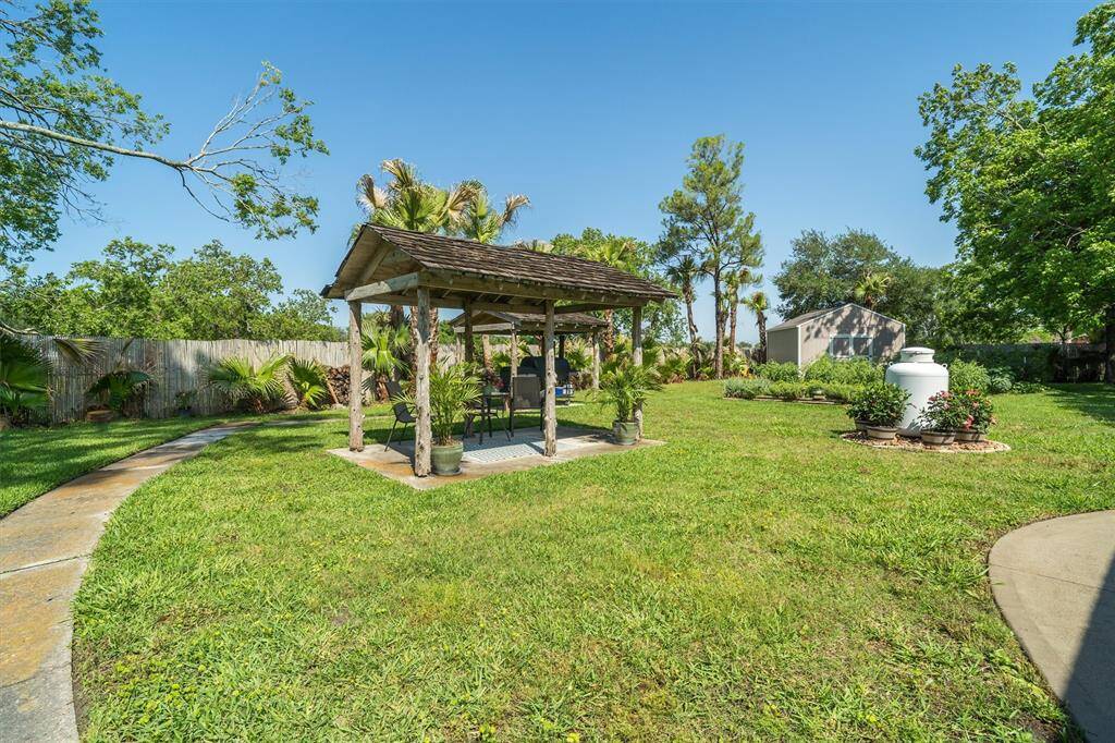 Detached covered seating area providing shade from the Texas sun!