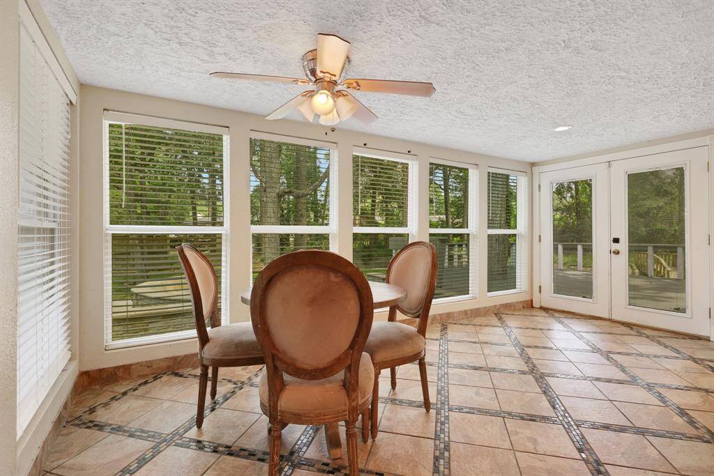 Cozy Sunroom. Sunlit room ideal for relaxation or enjoying morning coffee with backyard views.