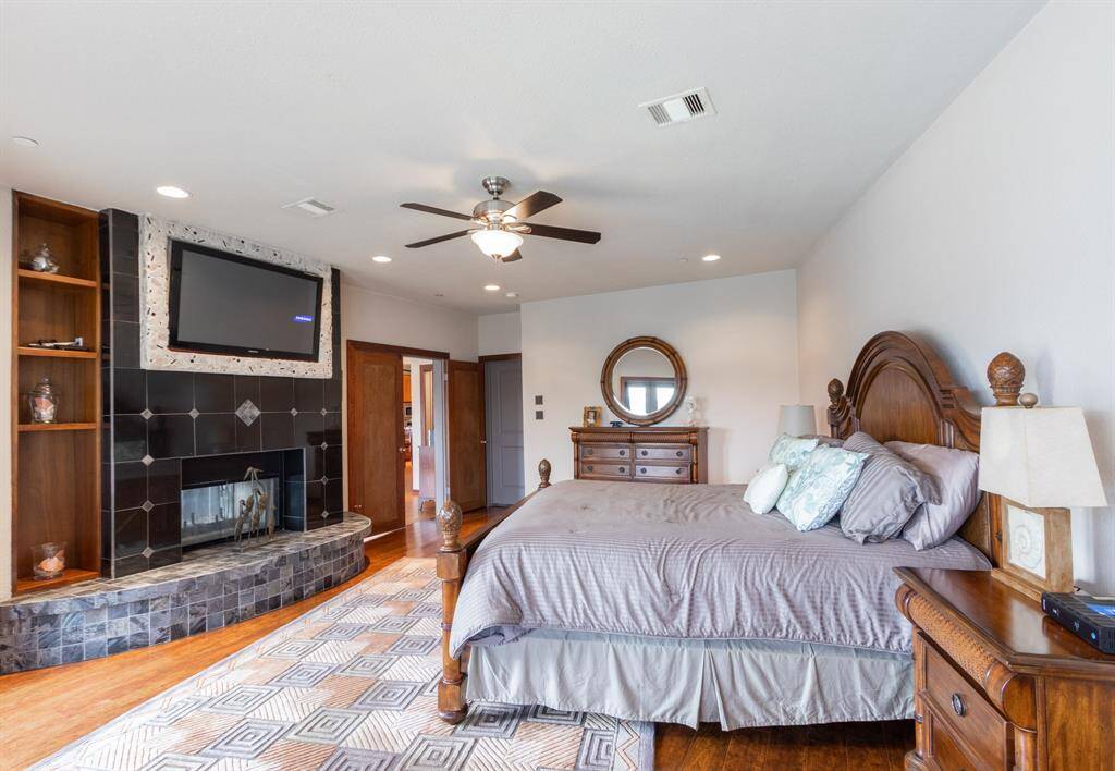 Primary bedroom with double-sided fireplace