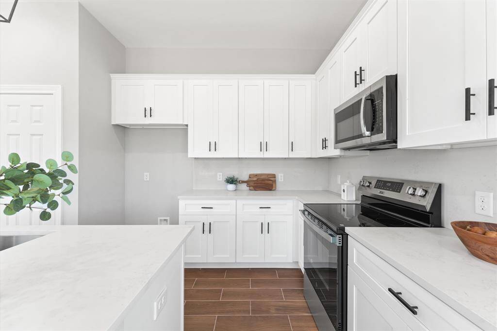 kitchen with Abundant cabinetry and prep space.