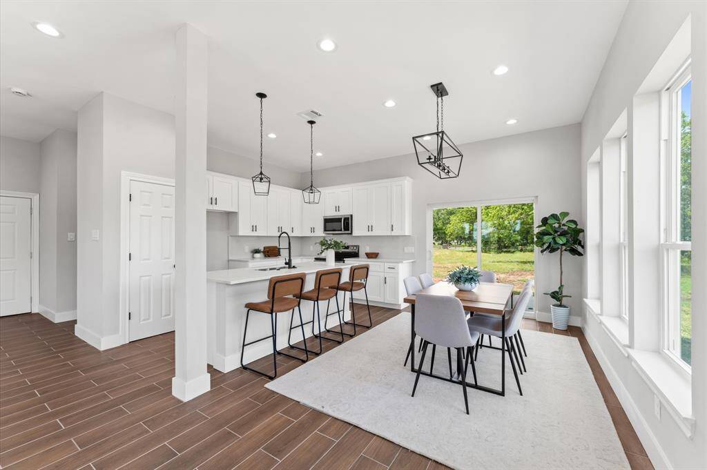 Dinning room overseeing the covered patio and green area.