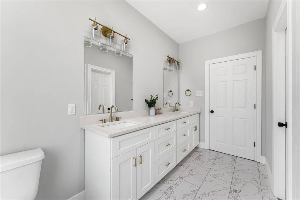 Elegant double sinks in the primary bathroom.