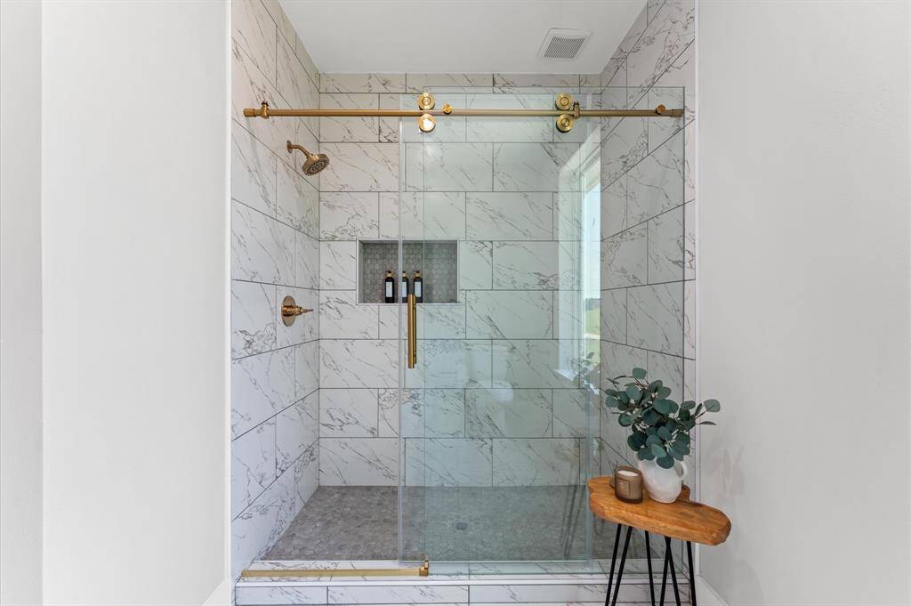 Large walk-in standing shower in the primary bath.