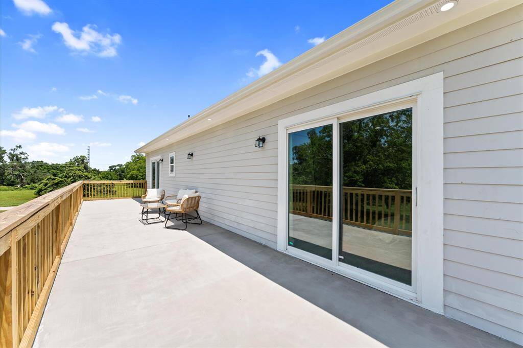 Primary suite offers direct access to a private balcony.