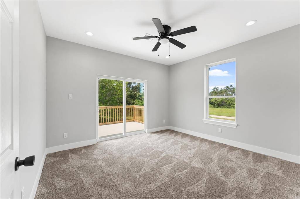 Spacious secondary bedroom with access to the balcony and lake views