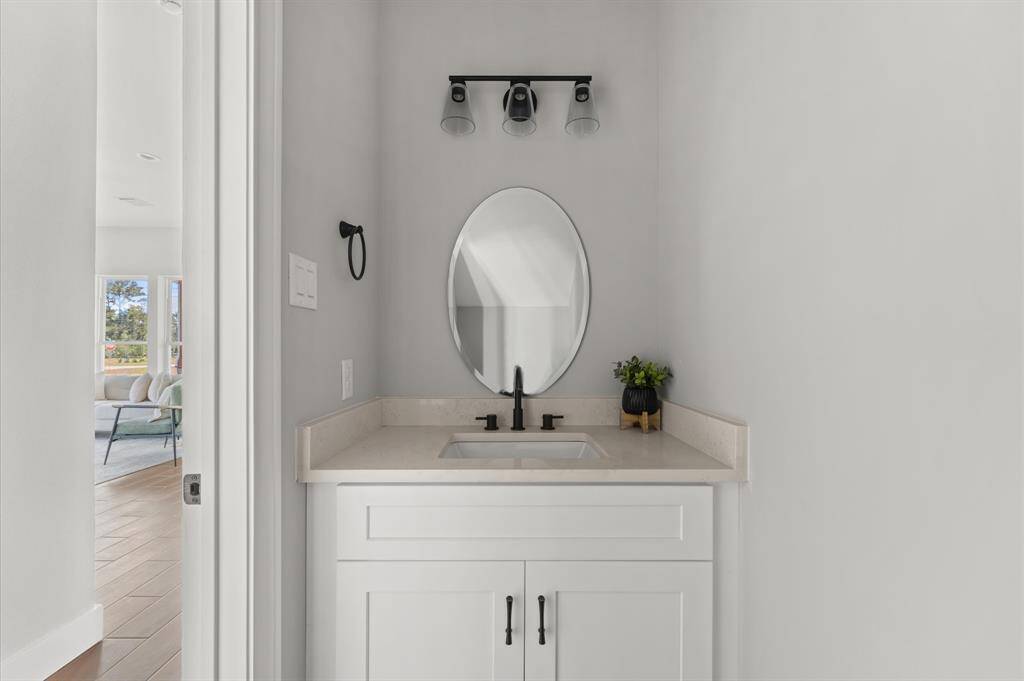 Half bath for guests near main living space.