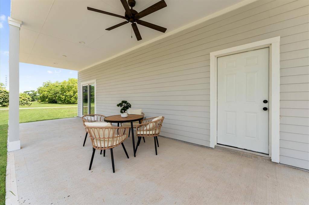 Spacious primary bedroom with direct balcony access and serene lake views.