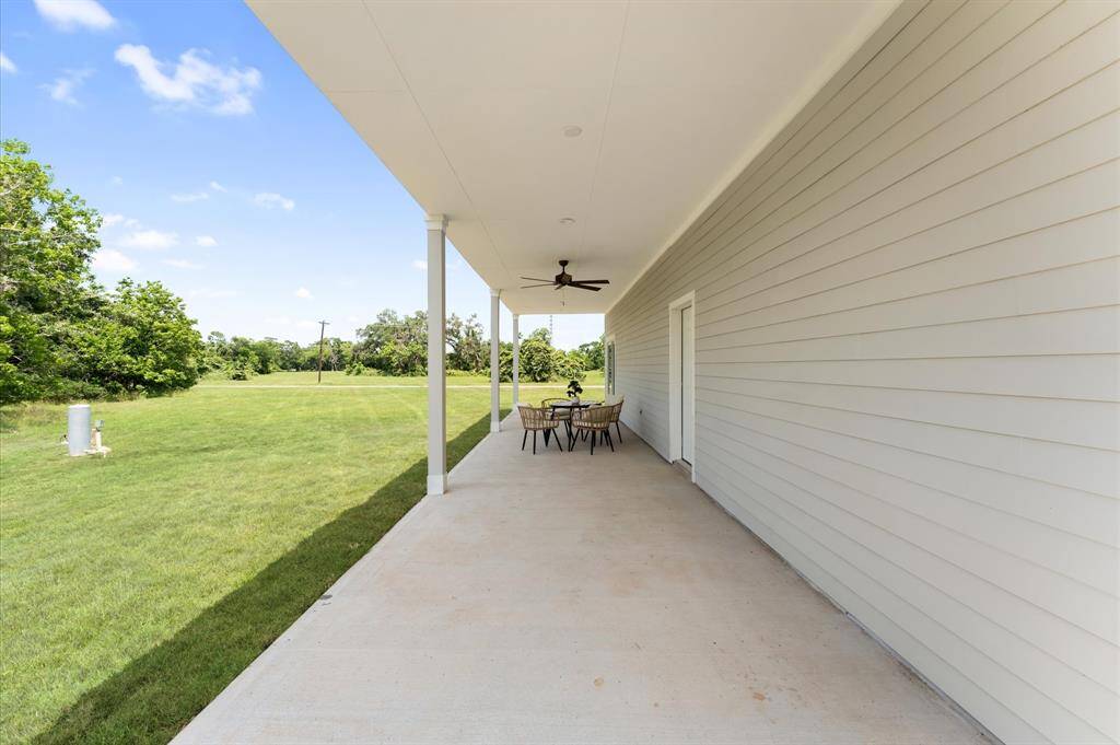 Spacious primary bedroom with direct balcony access and serene lake views.