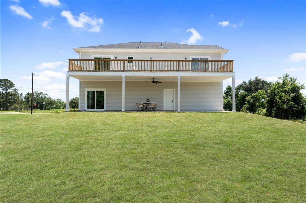 View of home from rear showing scale and layout.