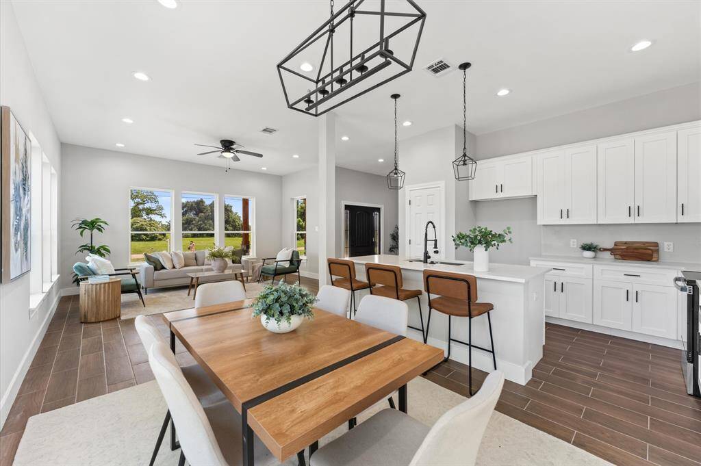 Living room seamlessly connects to kitchen and dining area.