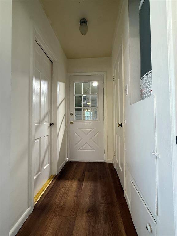 From the kitchen, past the door at the end of the mud room is the attached garage. Behind the door to the right is the pantry. Behind the door on the right is a closet/which a tenant in the past utilized as a dark room.