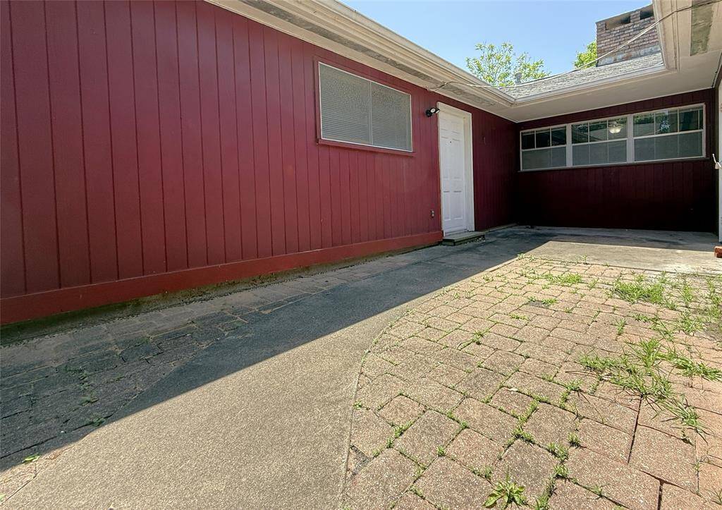 The concrete/paved patio offers ample room for furniture. The patio can also be accessed from a door in the attached garage.