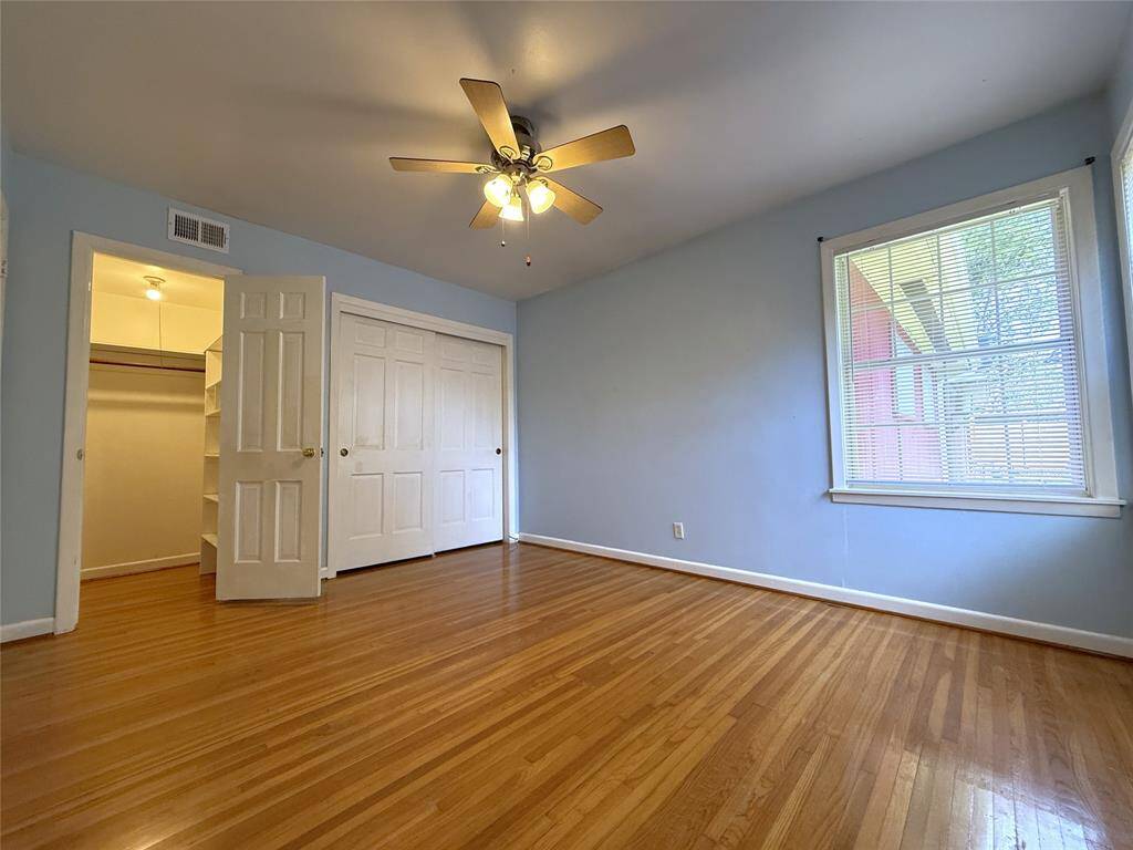 The back bedroom offers a wall of closet space including a step-in closet!