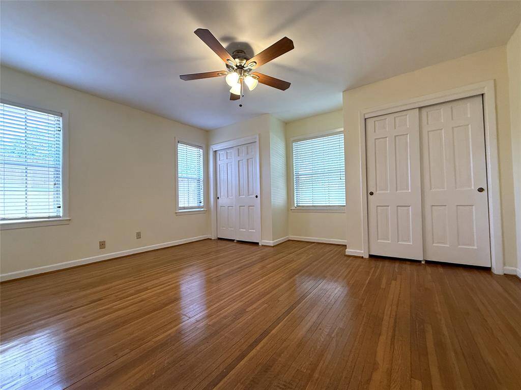 The front bedroom offers twin closets.