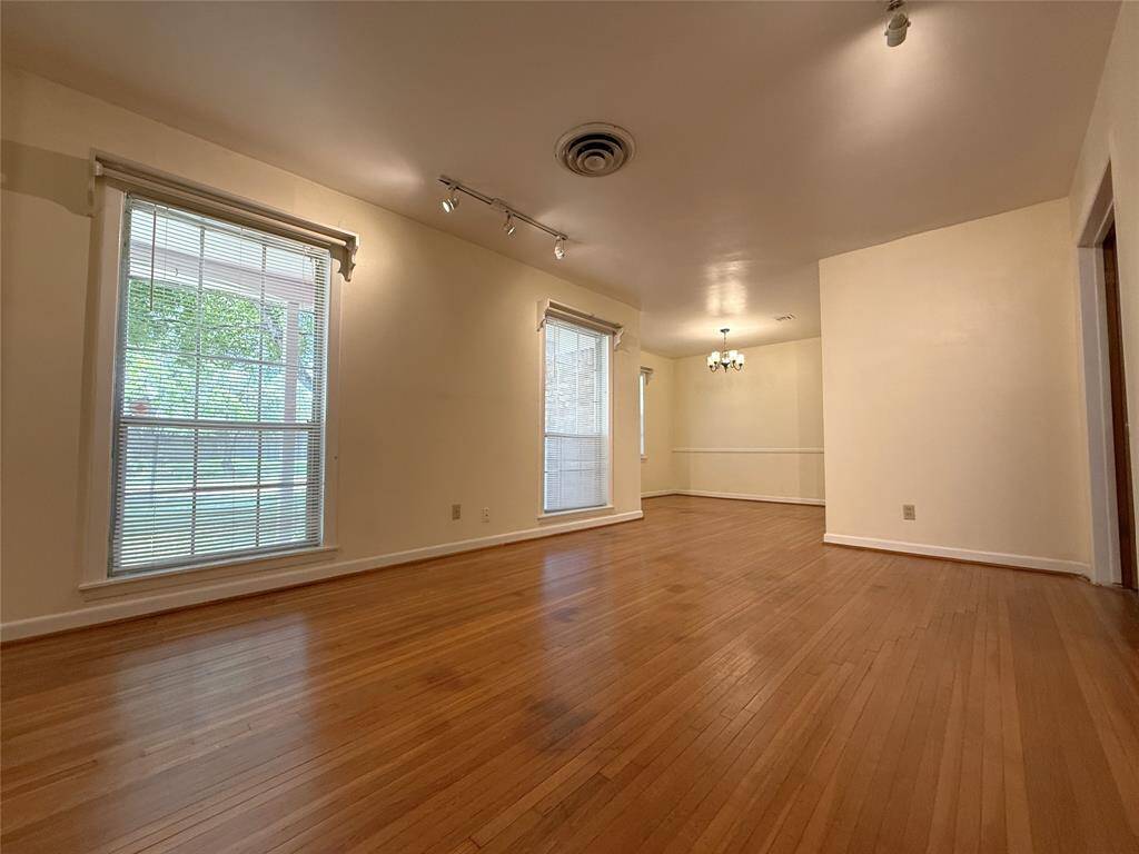 Past the living room is the adjoining dining room.
