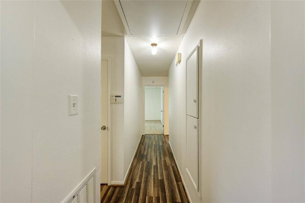 Hall has ungraded laminate floors.