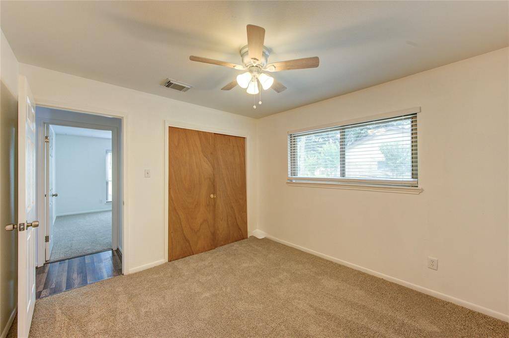 Double closet and new carpet grace this bedroom.