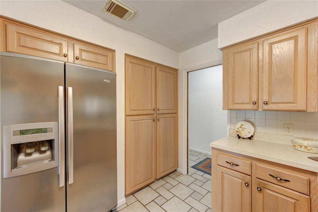 Double pantry and stainless steel fridge.