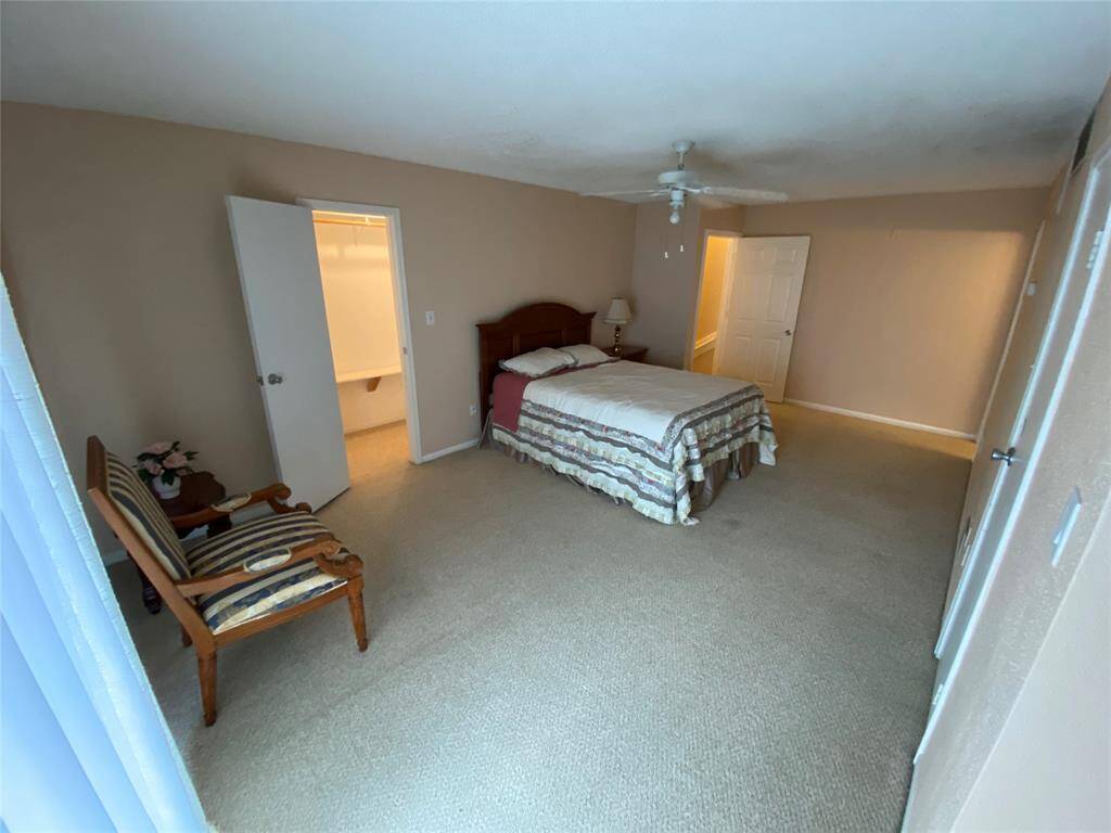 Spacious bedroom! Includes a seating area and access to a walk-in closet and en-suite bathroom.