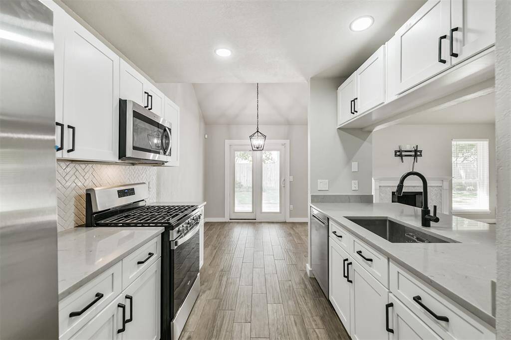 Updated appliances and crisp white cabinets!!