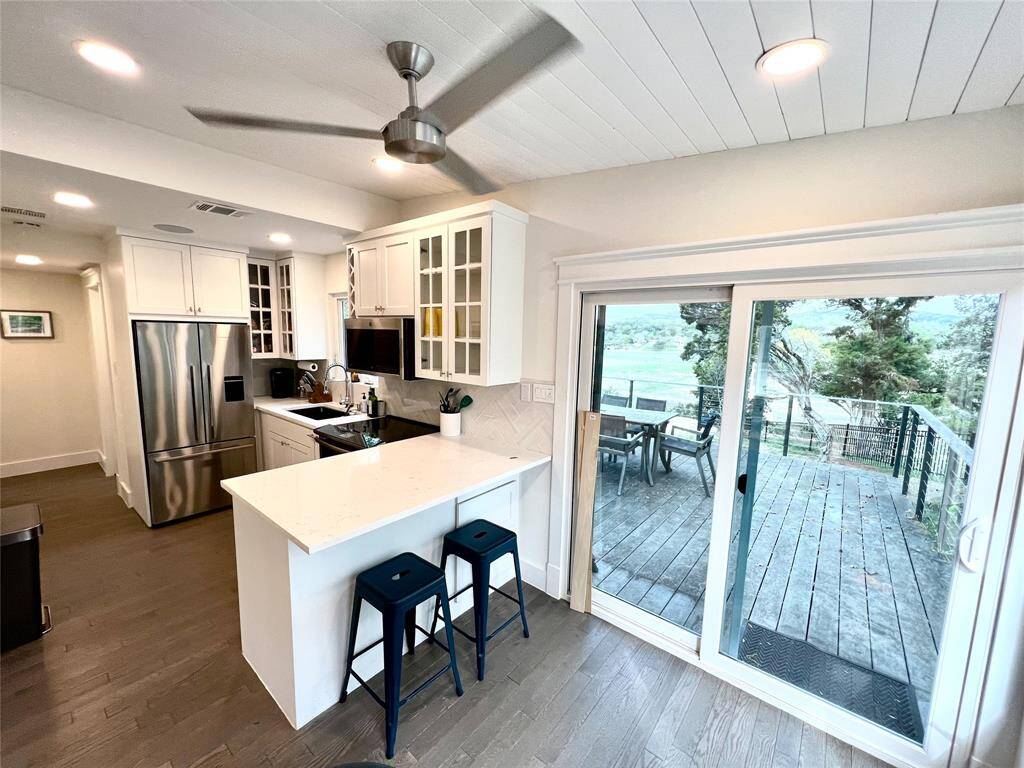 Sleek stainless steel French door fridge with a convenient water and ice maker.