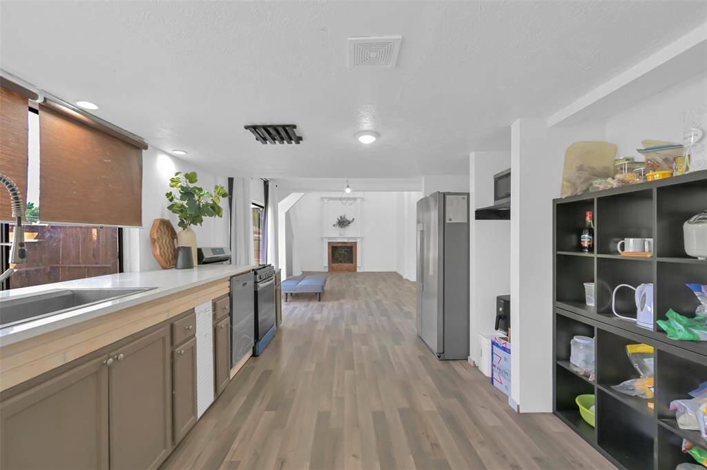 This spacious kitchen features modern appliances.