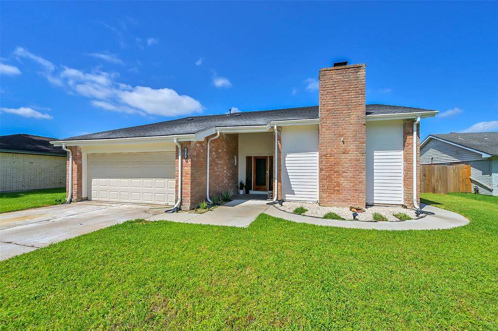 The home features a simple, clean facade with a welcoming entryway.