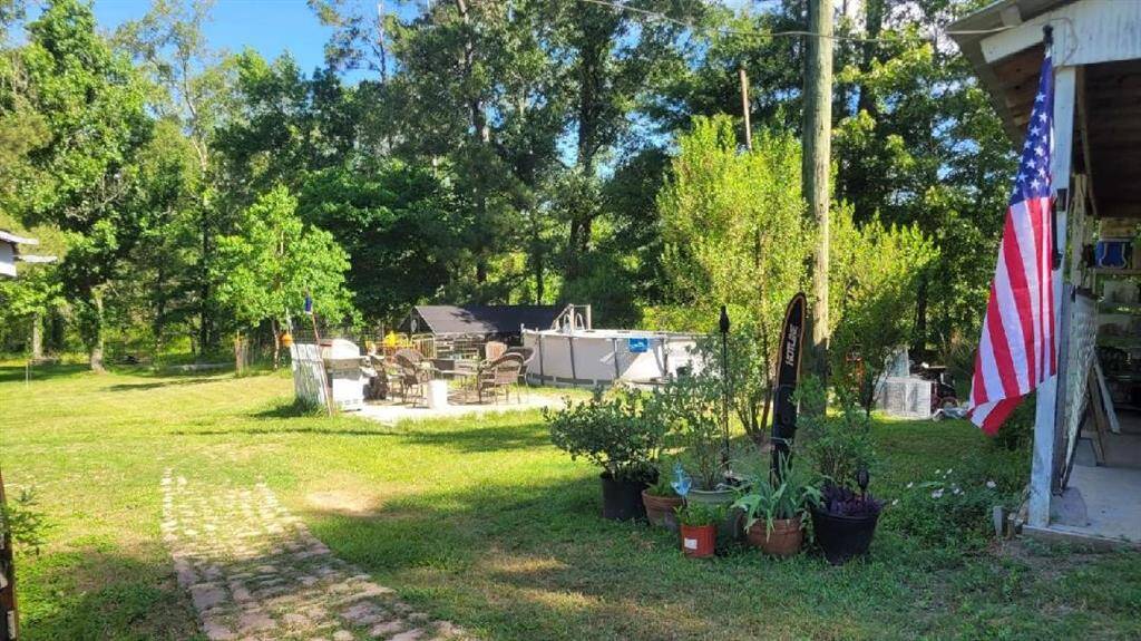 Pool area with chicken coop beyond.