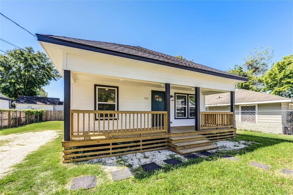 Charming single-story home with a welcoming front porch, modern exterior, and a spacious yard. Ideal for comfortable living in a friendly neighborhood.