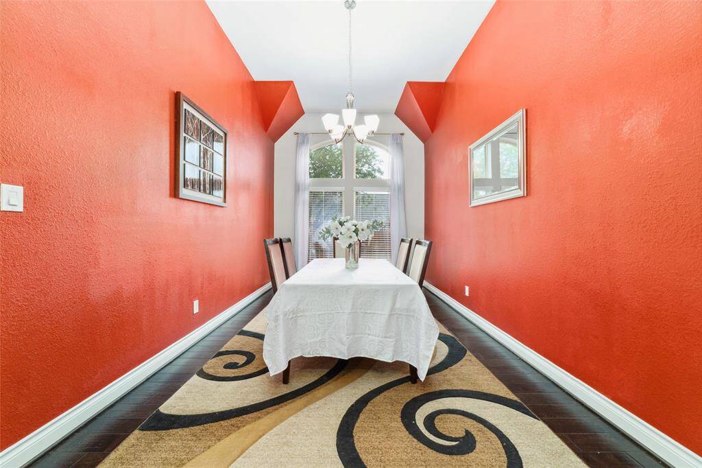 Formal dining room located just off the kitchen, spacious enough to accommodate a large dining table. Features elegant engineered wood flooring.  NOTE: Paint concession may be considered, giving you the opportunity to personalize the space.
