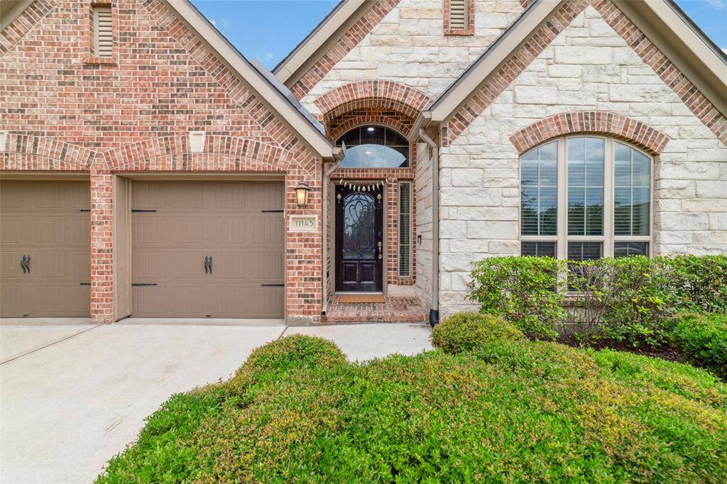 Beautiful Perry Home featuring a spacious 2-car garage and an upgraded stone front elevation, adding extra curb appeal and charm