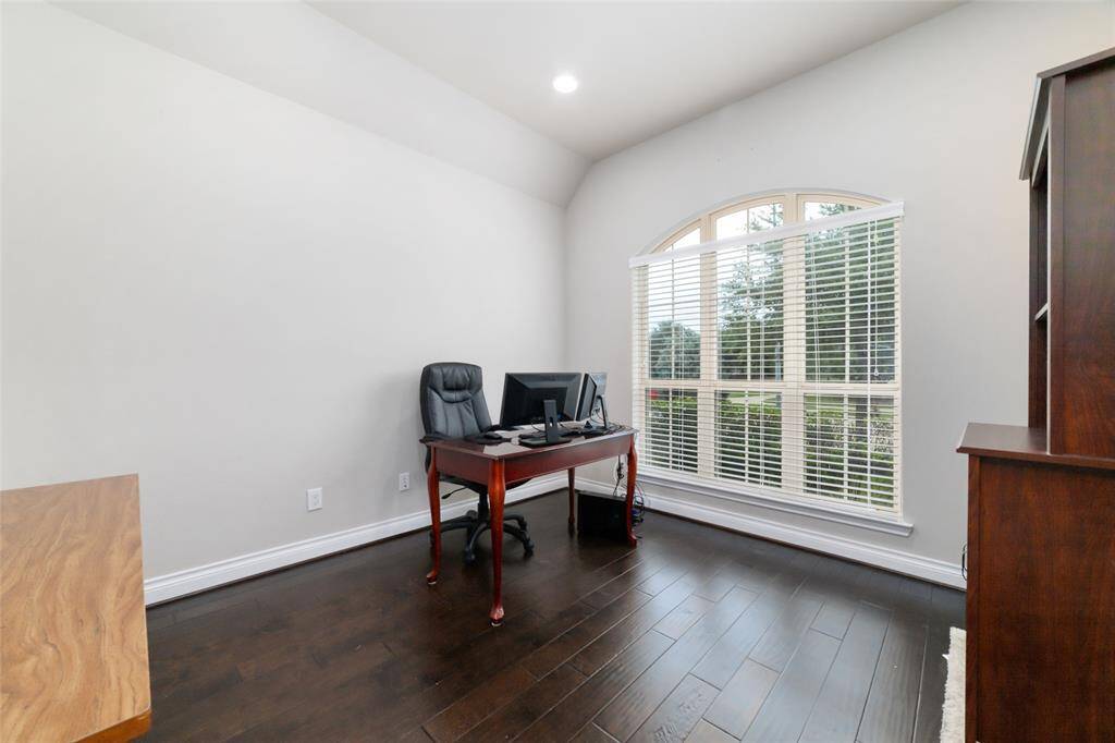 Bright, private home office with elegant engineered wood floors at the front of the house.