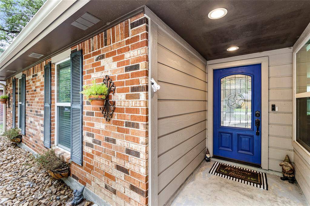 Lovely front porch entry and FUN front door!