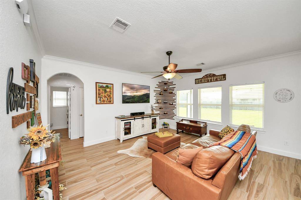 Den with HUGE windows, arched doorways and custom corner feature.