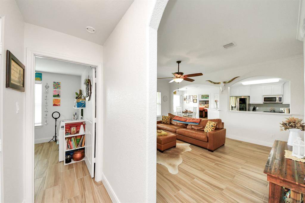 Hall leading to secondary bedrooms and bath
