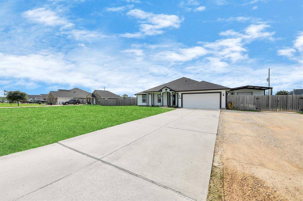 Double-Wide driveway with EXTRA driveway to shop.