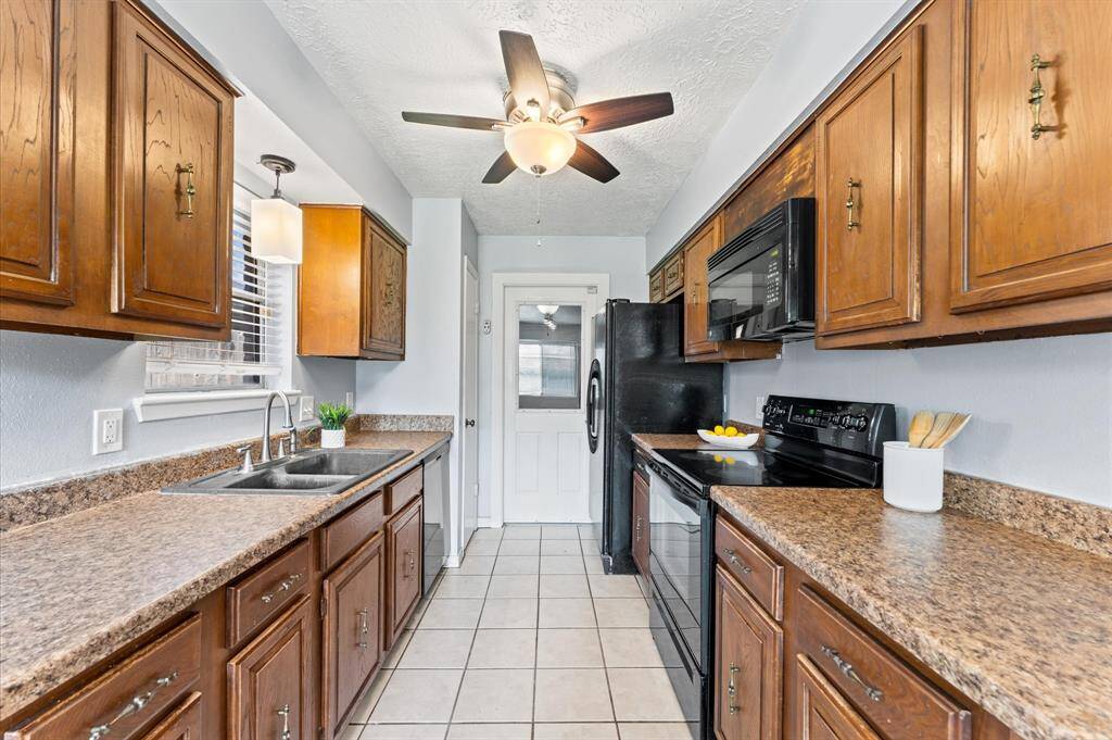 To the left of the dual sink vanity is the primary bath.