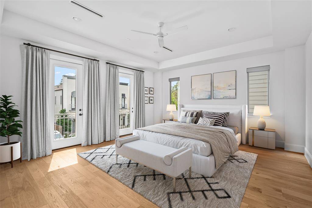 Large windows will flood the primary bedroom with natural light. *Virtual staging has been added*