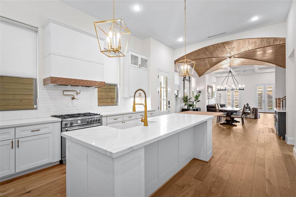 Step inside this beautiful home w/ soaring ceilings and stunning finishes throughout