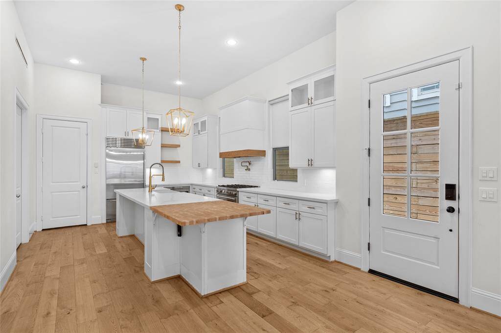 The kitchen offers plenty of storage for any kitchen needs and a large walk-in pantry.