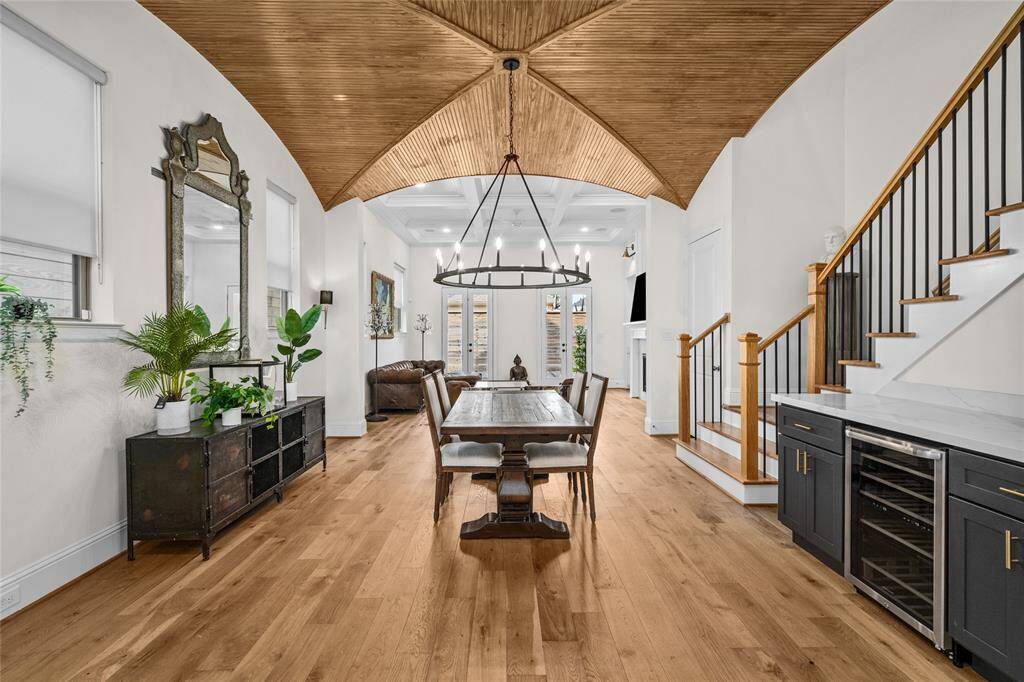 The open living space allows you to admire the gorgeous dining room ceiling from all angles.
