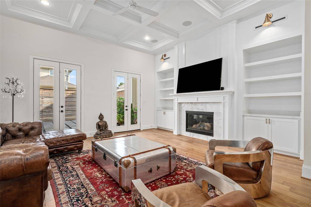 The living room will lead you outside, to the back patio of the home.